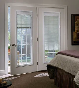White French patio doors with integrated blinds, multi-pane glass design with sidelights