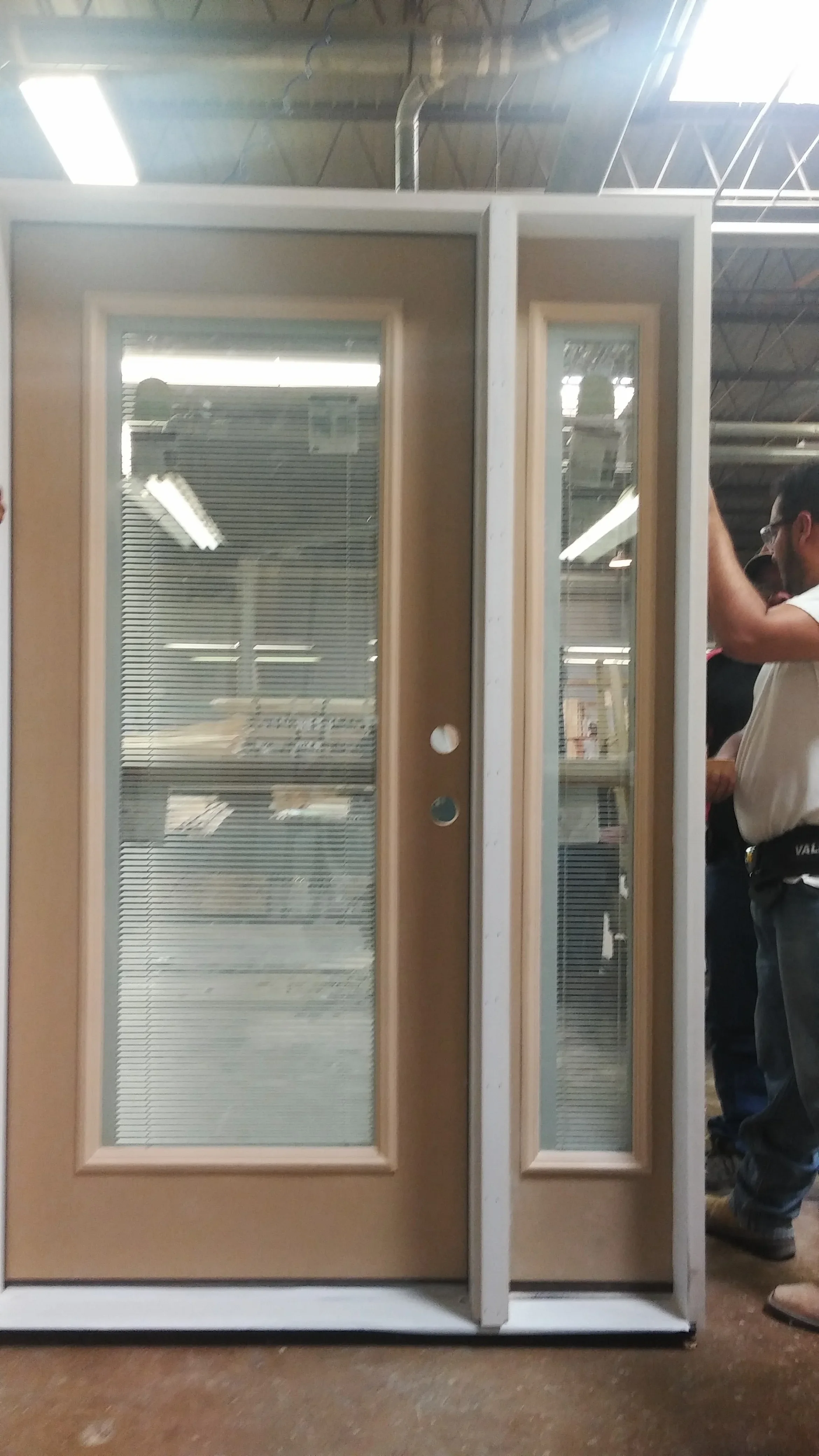 Wood-framed glass door with integrated blinds and sidelite panel, white trim