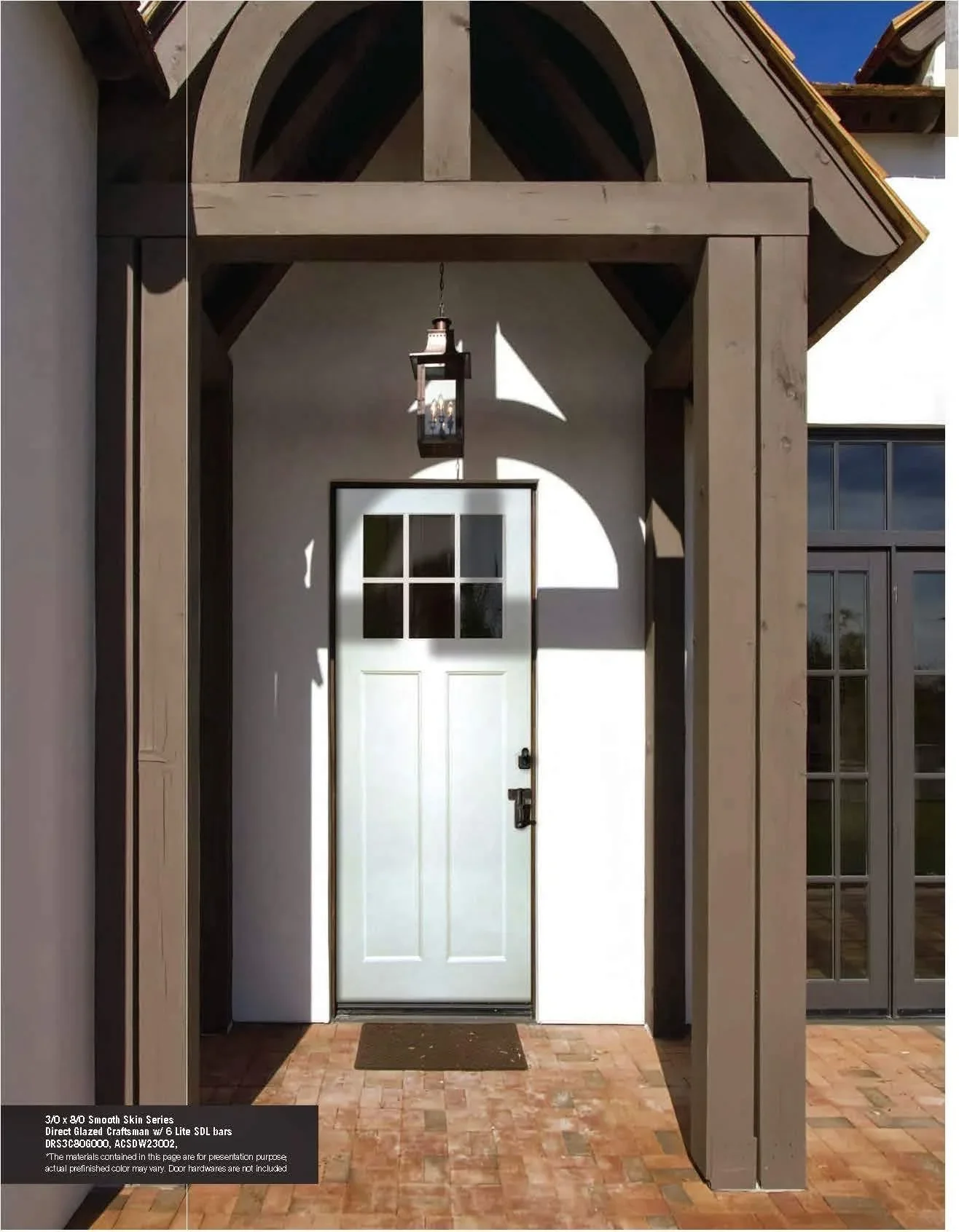 White six-panel entry door with glass panes in craftsman-style frame under covered porch