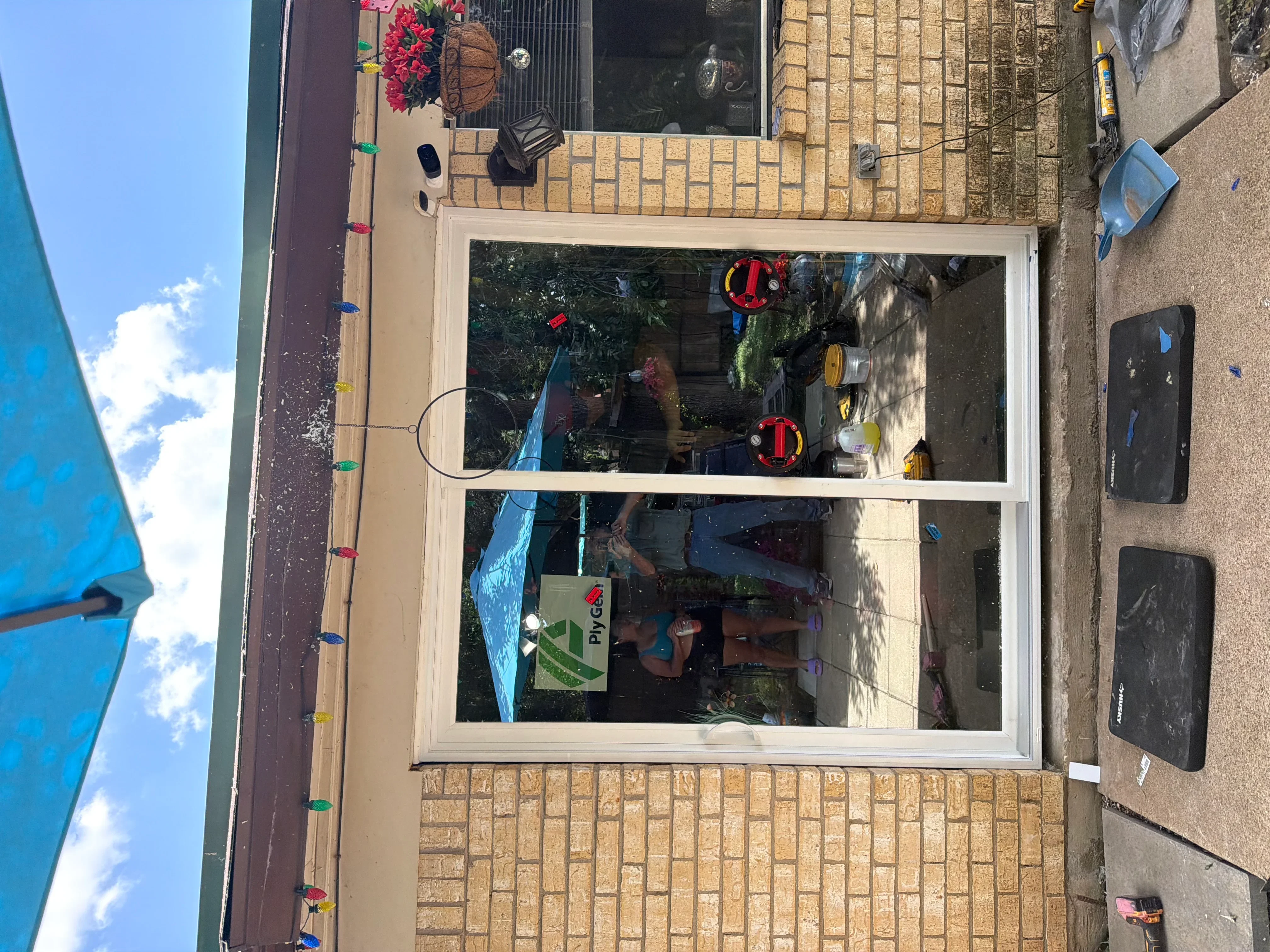 White aluminum storefront window with horizontal muntins installed in brick facade